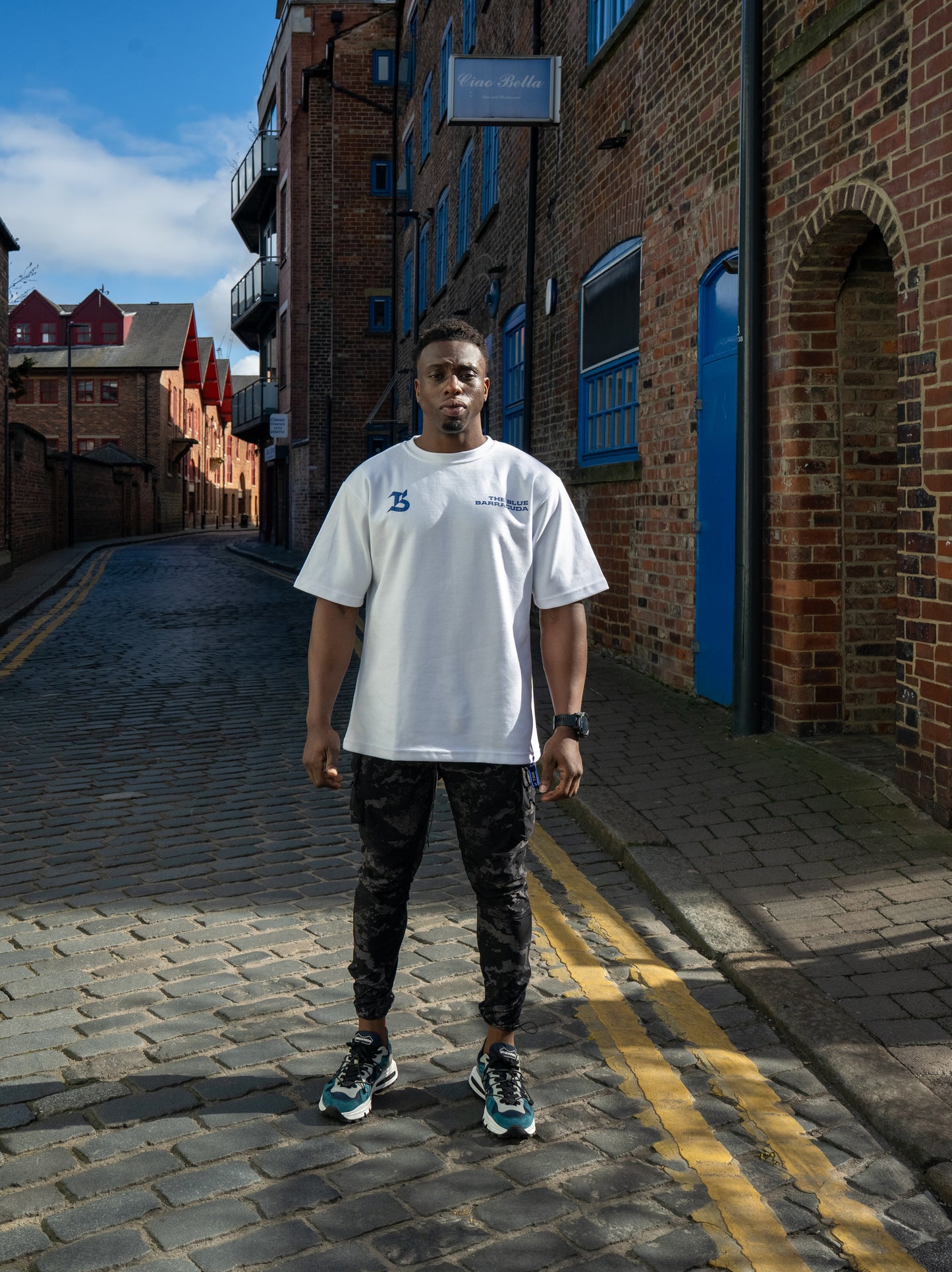 TBB TEE: OVERSIZED BACK LOGO